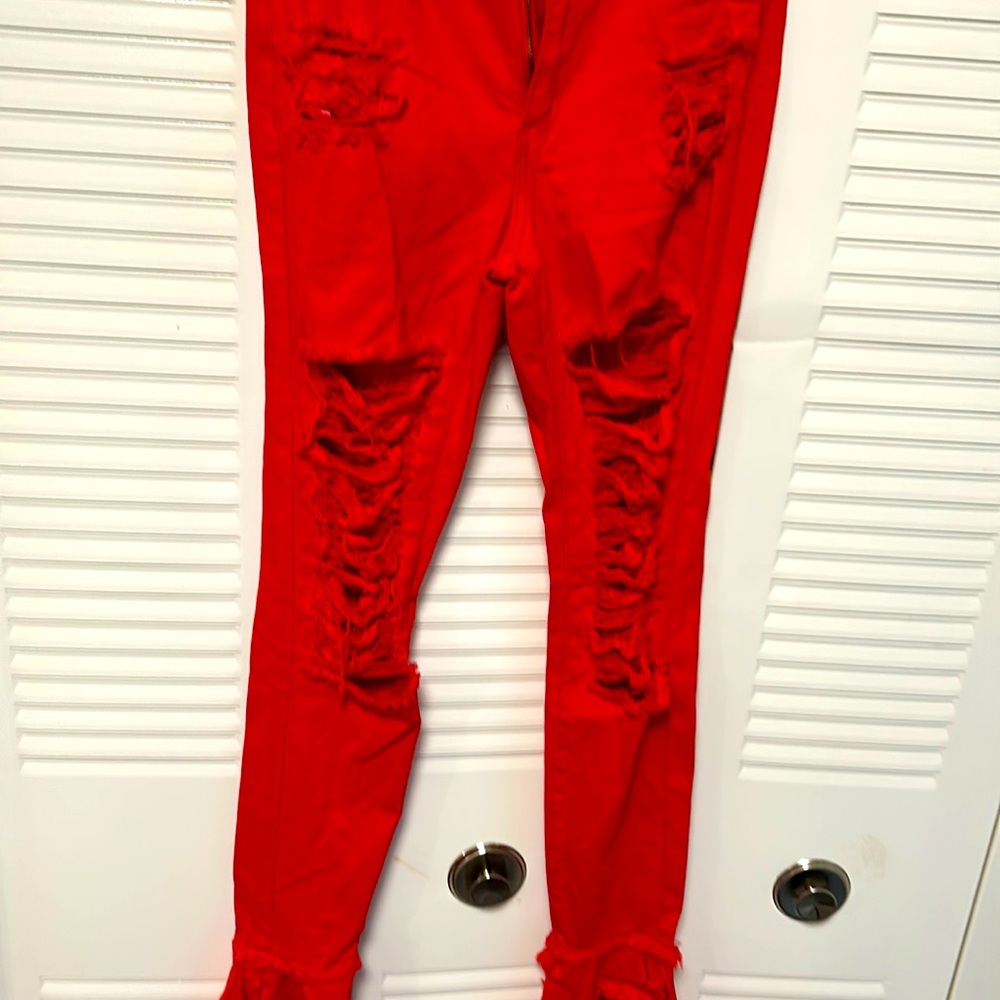 Bell bottom, rip front and back jeans